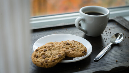 A cup of coffee and cookies. Caffeine Harmony: A Perfect Blend with Sweet Bites.