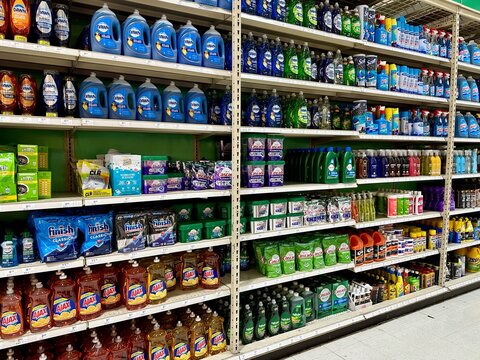 Various household cleaners and dish soap on a store shelf 