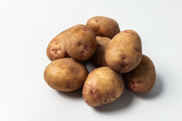 Raw potatoes isolated on a white background. A popular vegetable. An essential product for cooking