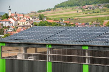 Many solar panels on the roof of the enterprise © tsirika