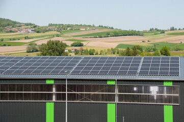 Many solar panels on the roof of the enterprise © tsirika
