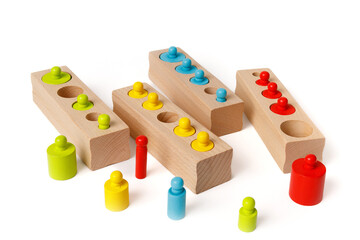 Kids's wooden educational Montessori puzzle toy set isolated on white background.