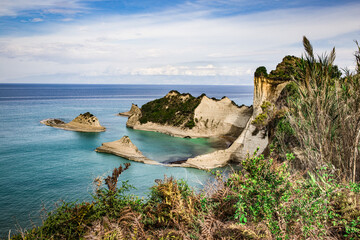 Cape Drastis, the impressive formations of the ground, rocks  and the blue waters panorama, Corfu,...