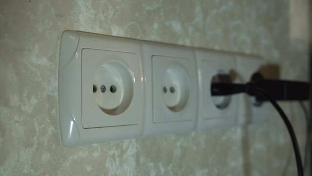 various plugs of electrical appliances are inserted into 4 connected sockets in turn
