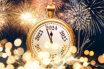 Vintage golden clock points to 2024 new year with lights bokeh and fireworks. New Year card,...