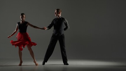 Elegant Ballroom Dance Couple on Spotlight.