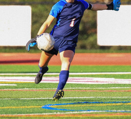 Soccer goalie kicking the ball