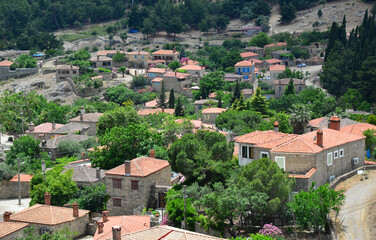 Fototapeta na wymiar The historical Adatepe Village, located in Canakkale, Turkey, attracts attention with its old houses, mosque and fountain built during the Ottoman period. It is an important tourism region.