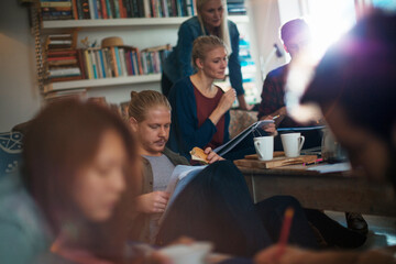 Group of students having study session at home