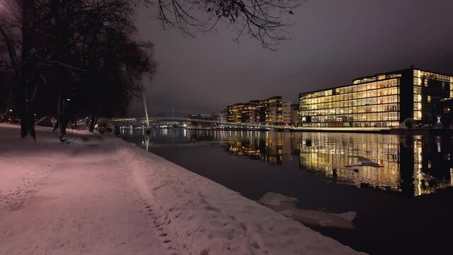 Drammen city, Norway. The river is called Drammenselva, and the bridge is called Ypsilon.  The city's library is located on the right side of the river.