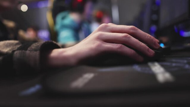 Cyber sport e-sports tournament, team of professional gamers, hands on a mouse and keyboard, gamers playing online championship in competitive moba, strategy fps game in a cyber games arena club