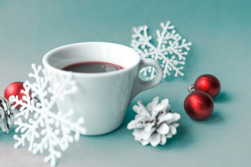 Obraz na płótnie Canvas Coffee cup and Christmas decorations on blue background. Merry Christmas and Happy New Year