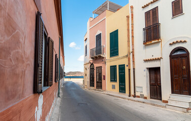 Urban street with typical mediterranean houses on the island Favignana in Sicily, province of Trapani, Italy