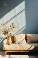 a blue couch is illuminated by sunlight