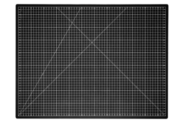 A black cutting mat with a white grid is isolated on transparent background.
