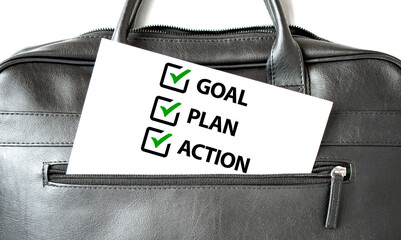 Text 2024 GOAL PLAN ACTION writing on white paper sheet in the black business bag. Business concept - Powered by Adobe