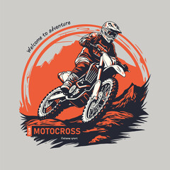A motocross rider in dynamic motion set against a vivid orange backdrop.