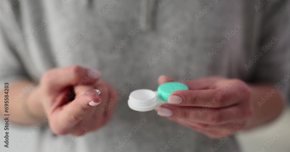 Sticker Soft contact lens with container in female hands