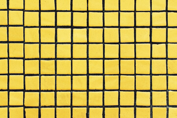 Yellow square ceramic tile background. Geometric wall decoration. Home bathroom floor. Ornamental...