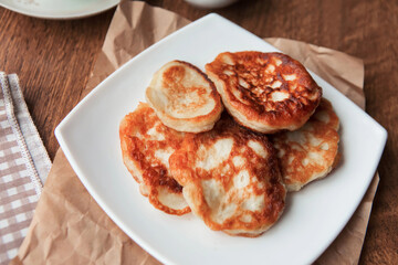 Sweet homemade pancakes on white plate