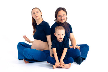 beautiful european happy family with a pregnant mother, the father and a son together. High quality photo
