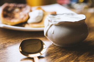 Sou cream bowl and pancakes