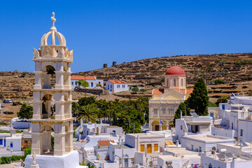 Church, whitewashed houses and arid landscape on Tinos Island
