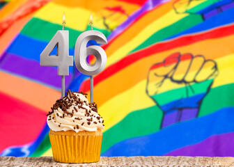 Birthday candle number 46 - Gay march flag background