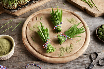 Bundles of fresh barley grass blades on a table
