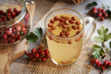 Herbal tea with fresh ripe hawthorn berries