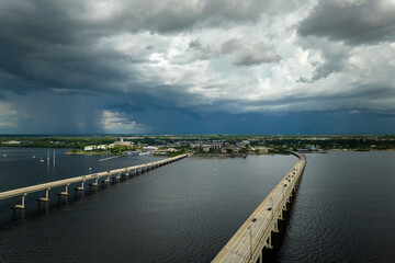 Barron Collier Bridge and Gilchrist Bridge in Florida with moving traffic. Transportation...