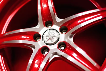 Fotobehang new alloy car wheel closeup, red color © soleg