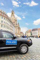 German Police black SUV car at Dresden Altstadt city street on New Market square Neumarkt for...