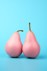 Pink pears  on a blue background.Minimal creative food concept