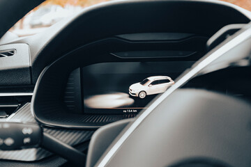 Lcd screen cockpit in a modern car carbon fibers interior close up
