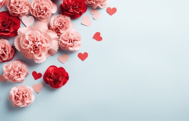 pink carnations with paper hearts and red hearts on a blue background