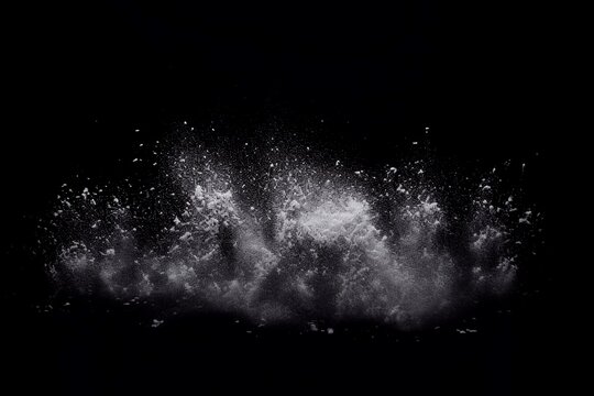 Explosion of white powder isolated on black background. Abstract white dust cloud texture. Snowstorm at night
