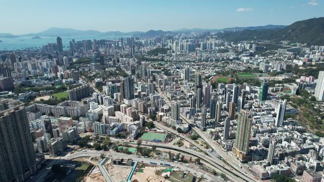 Sport theme commercial residential facility construction site in Kai Tak Hong Kong city, Kwun Tong and Kowloon Bay near Victoria harbor, Aerial drone