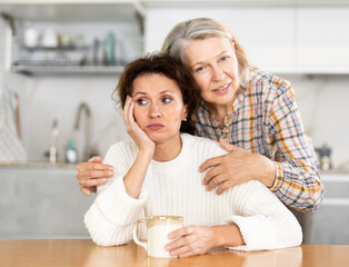 Elderly mother calms her daughter down and asks her for forgiveness after a domestic quarrel in the...