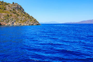 Green relief island. Background with selective focus and copy space