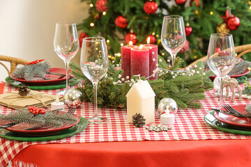 Festive dining table served for Christmas celebration, closeup