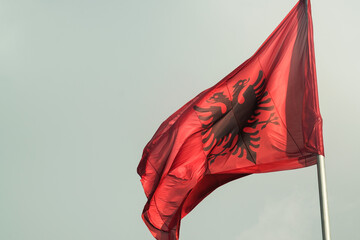 Albanian Flag Against Blue Sky..