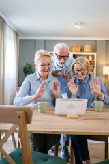 senior mature family or friends use digital tablet online video call