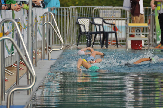Athletes swimming in the pool during a triathlon competition in Germany
