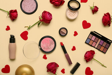 Obraz na płótnie Canvas Cosmetic products with red roses and hearts on yellow background. Valentine's day celebration