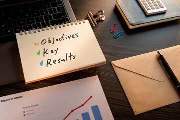 There is notebook with the word Objectives Key Results. It is as an eye-catching image.