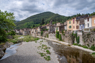 Fototapeta na wymiar The Rieutord River flows through the French town of Sumene in the Cevennes, France