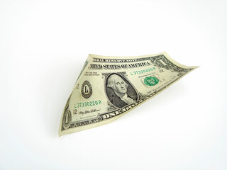 A twisted US one dollar bill placed at an angle.white background.