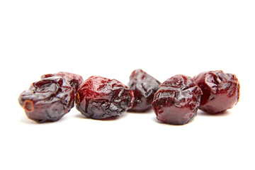 Dried cranberries isolated on white background. Group of sweetened red cranberries closeup