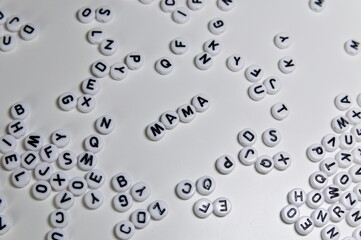 close up alphabet beads with the word MAMA